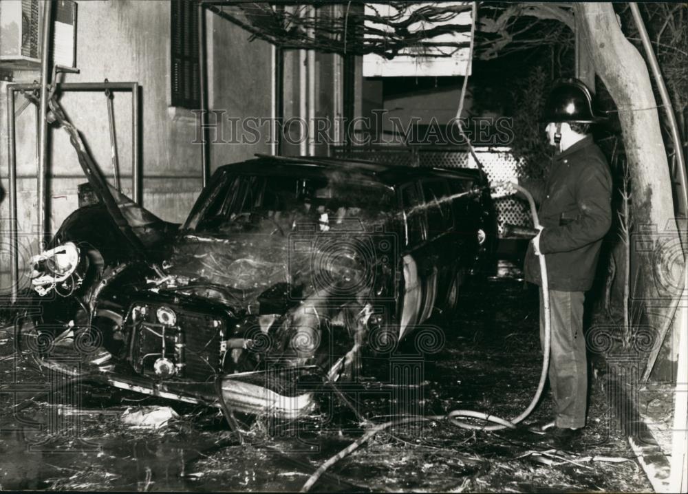 Press Photo Automobile On Fire, Fireman Attempts To Douse Flames In Greece - Historic Images