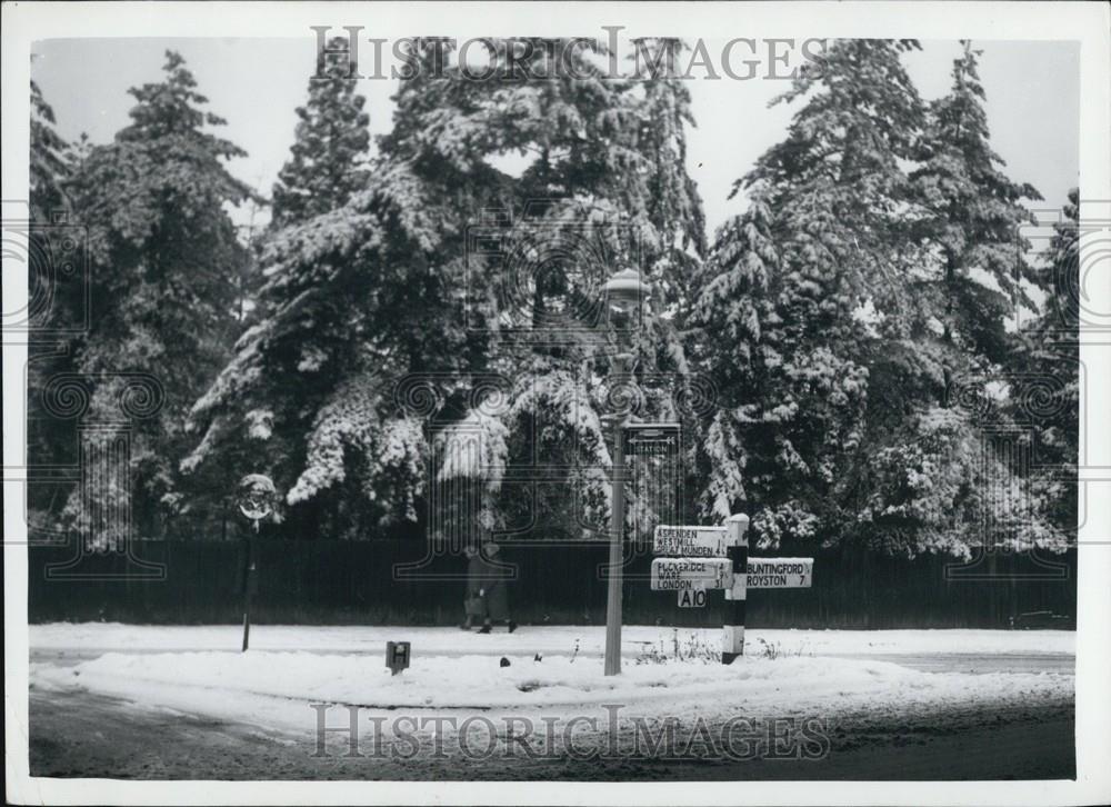 Press Photo Snow-Covered Ground Roadside Signs - Historic Images