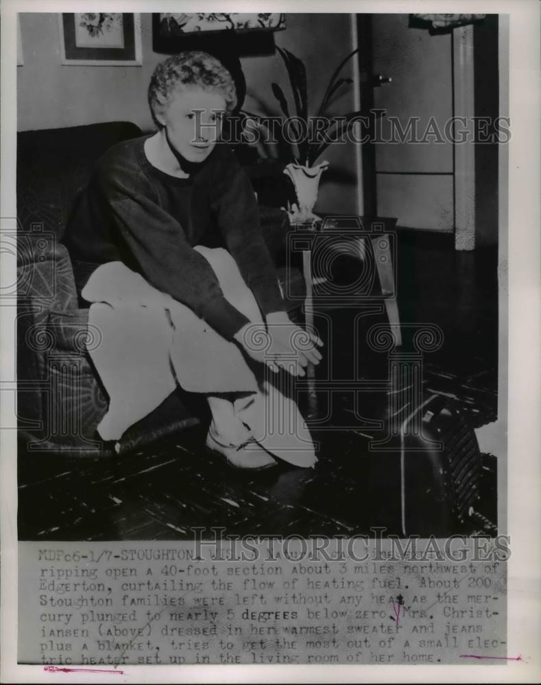 1953 Press Photo Mrs. Christiansen, dressed in her warmest sweater and jeans - Historic Images