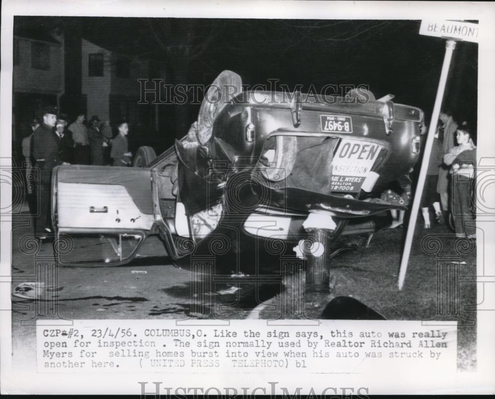 1956 Press Photo of a car the was struck by another and turned over. - Historic Images