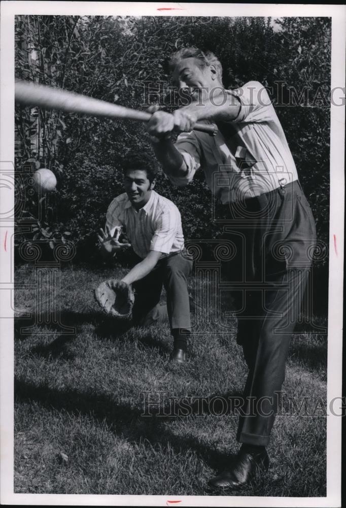 1969 Press Photo Ralph J. Perk and son Ralph Jr., relax with a ballgame - Historic Images