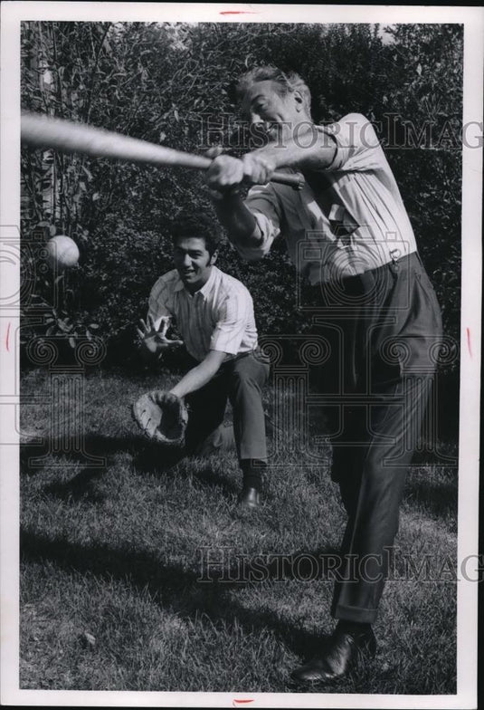 1969 Press Photo Ralph J. Perk and son Ralph Jr., relax with a ballgame - Historic Images