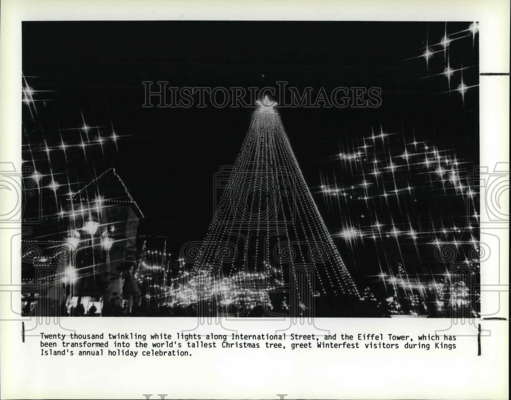 1987 Press Photo Twinkling lights along the International street &amp; Eiffel tower - Historic Images