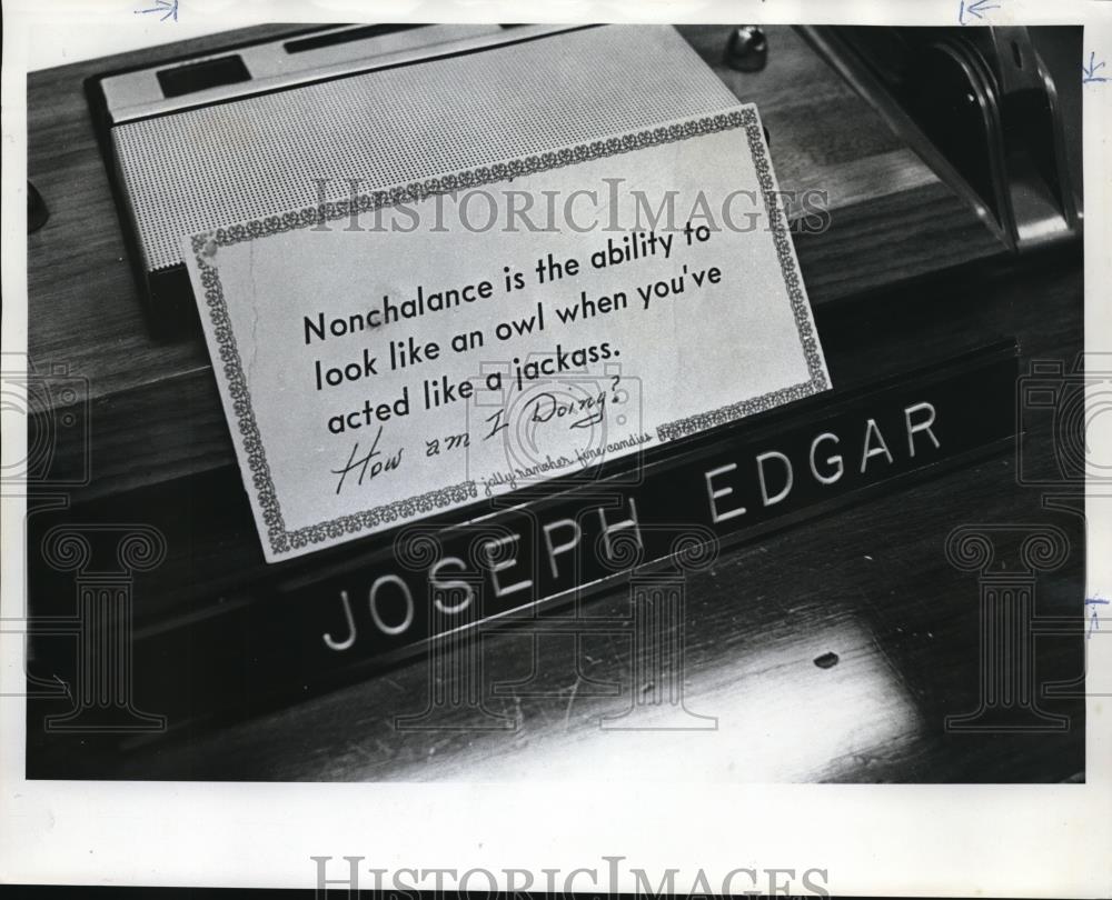 1973 Press Photo Joseph Edgar, desk sign, humor - ora20199 - Historic Images