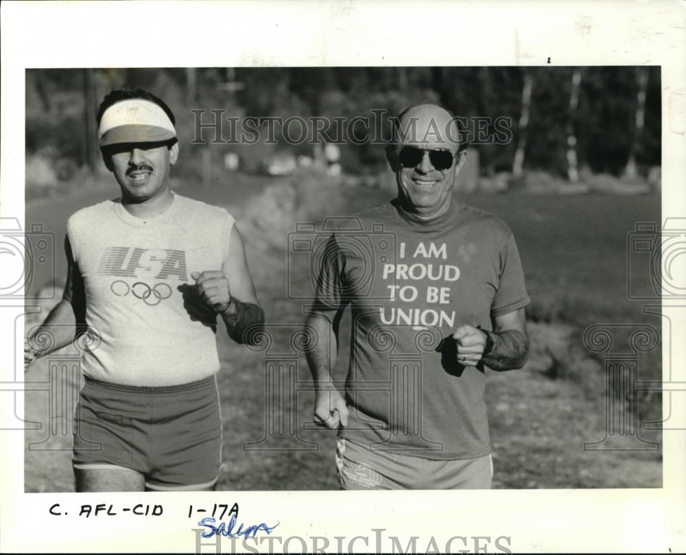 1985 Press Photo Pres. Irving Fletcher takes a break from work to run in Salem - Historic Images