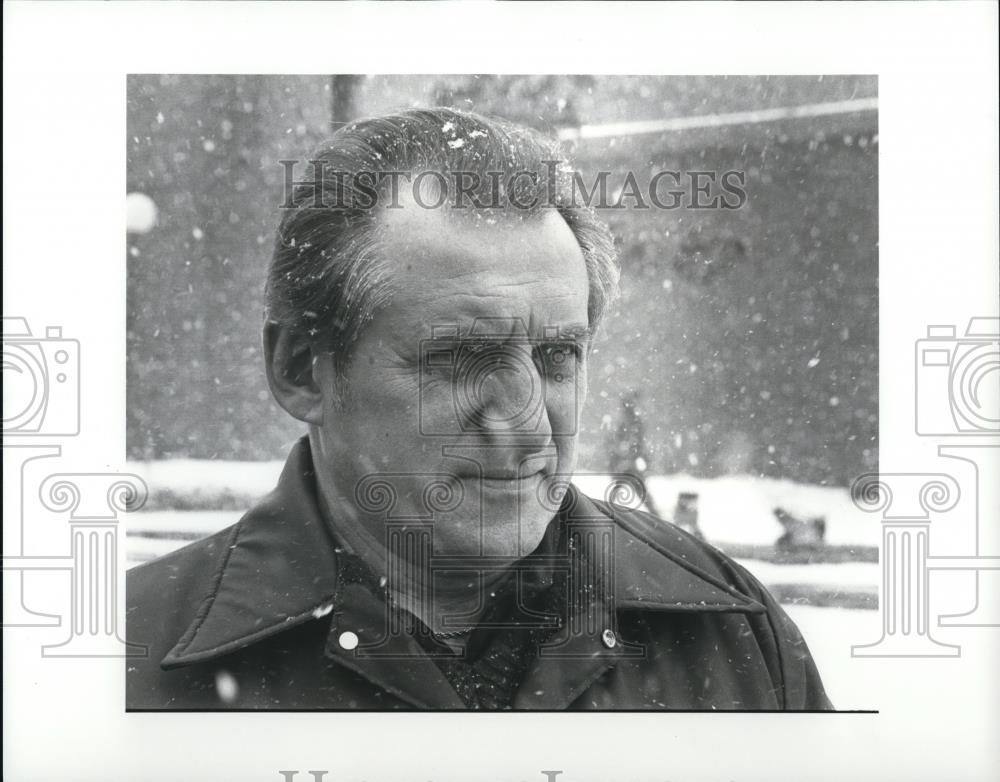 1983 Press Photo Jim Riha standing in the snowy background - Historic Images