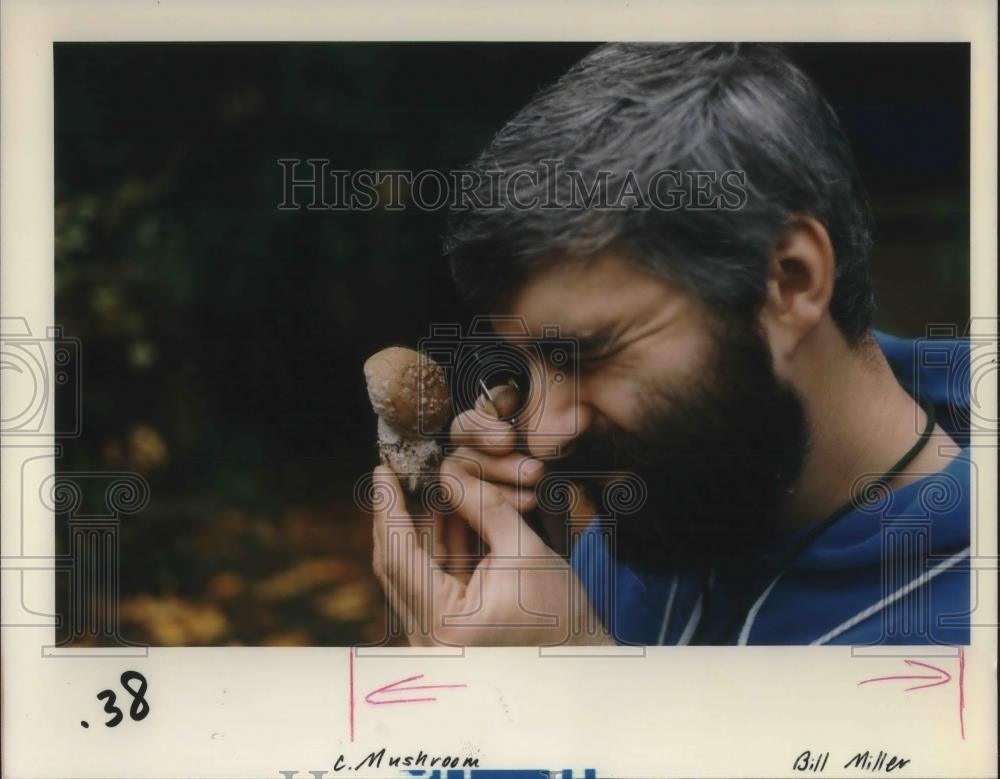 1988 Press Photo Preston Alexander inspecting a toxic mushroom - ora14533 - Historic Images