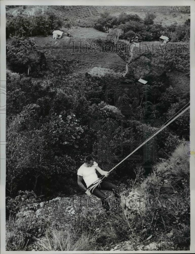 1961 Press Photo John E. McPhee Practices On A Steep Slope For The Peace Corp. - Historic Images