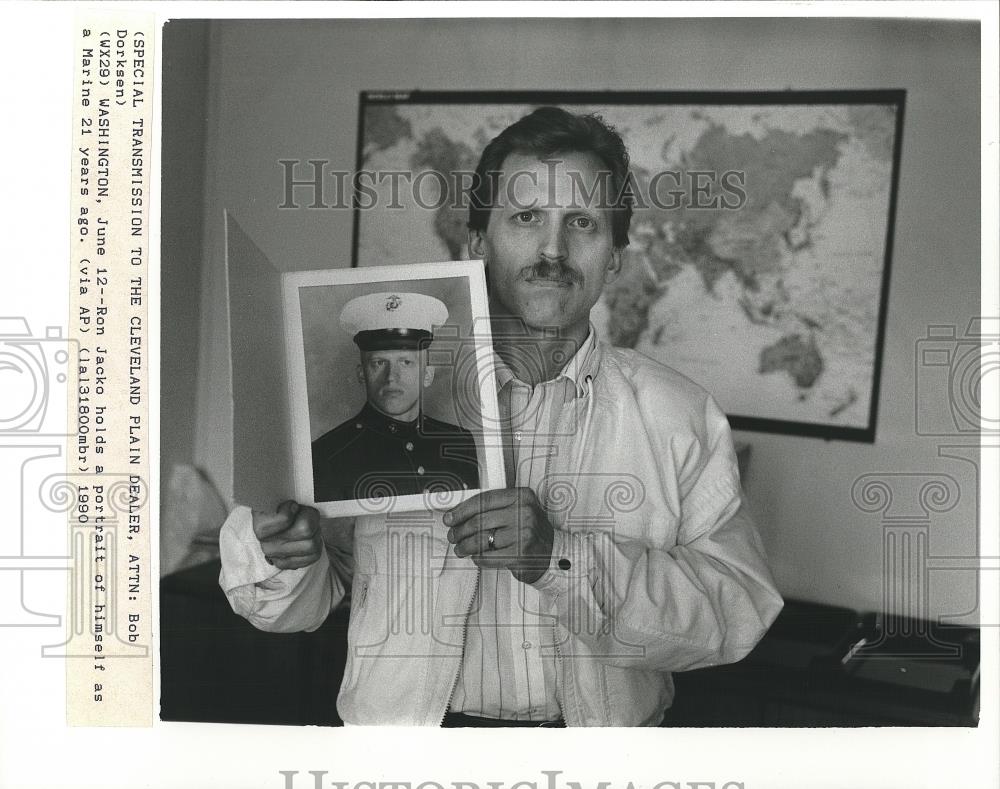 1990 Press Photo Ron Jacko Holds Portrait Of Himself 21 years ago - cvp26059 - Historic Images