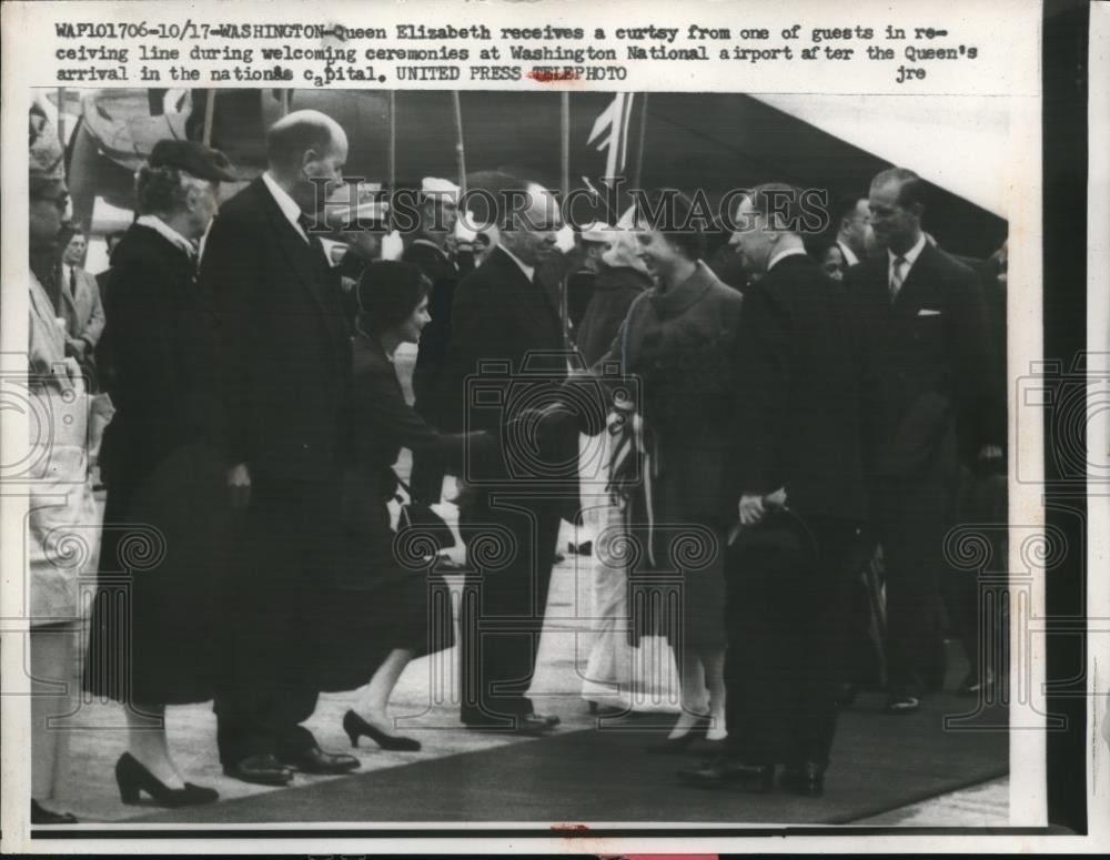 1957 Press Photo Queen Elizabeth Receives a Curtsy from one of the guests - Historic Images