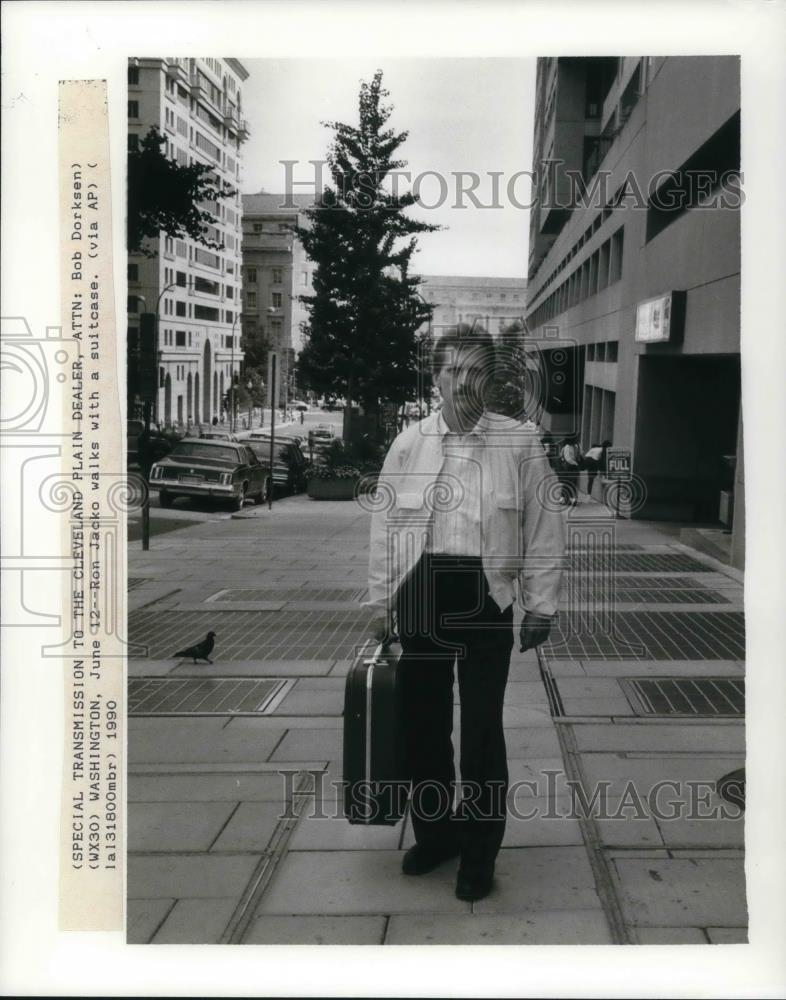 1990 Press Photo Ron Jacko walking with a suitcase - cvp20433 - Historic Images