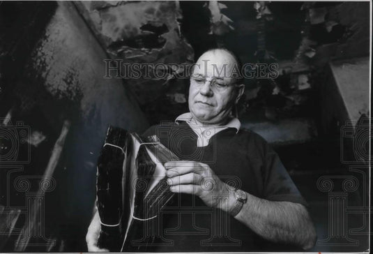 1975 Press Photo Friar Albert Jamme holds research burned by fire - cvp20731 - Historic Images
