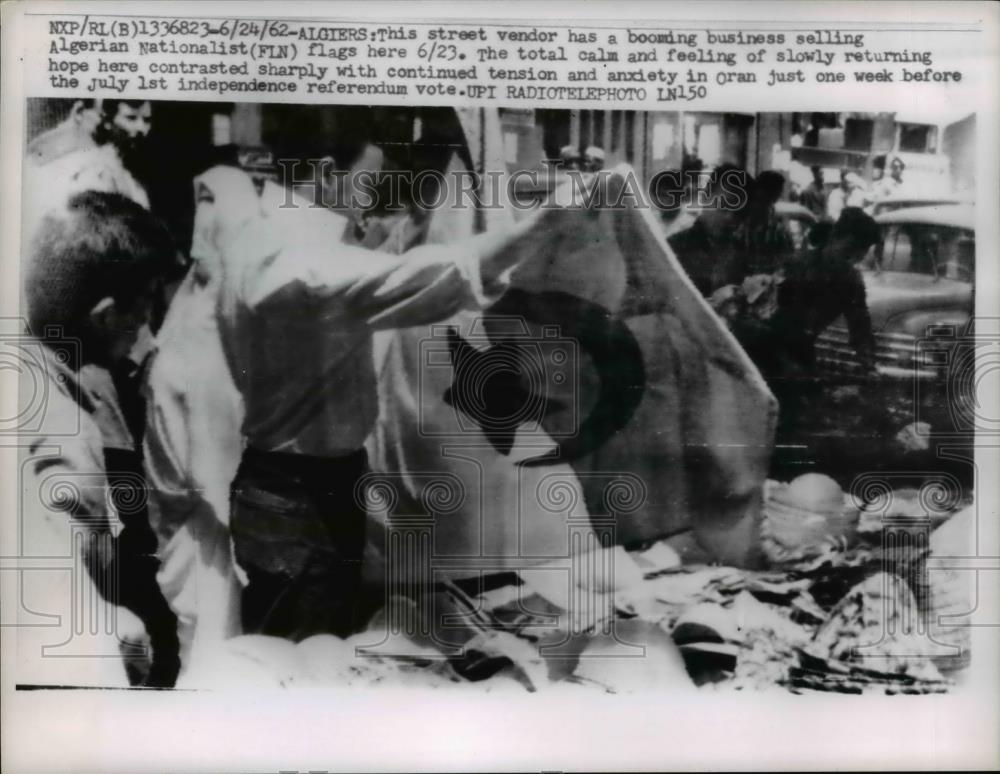 1962 Press Photo Street Vendor Sells Flags in Algiers - Historic Images