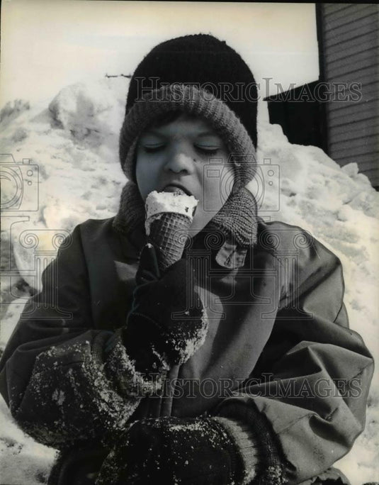 1966 Press Photo Greg Thompson Eats Ice Cream Cone in Snow Madison Wisconsin - Historic Images