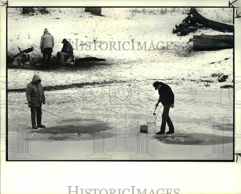 1987 Press Photo Ed Kenny and Tom Hill with the ice holes on the Rocky river - Historic Images