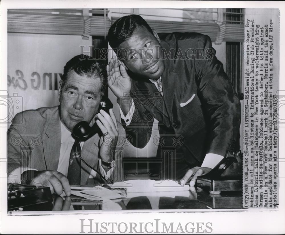 1957 Press Photo Middleweight Champion Sugar Ray Robinson Is All Ears - Historic Images