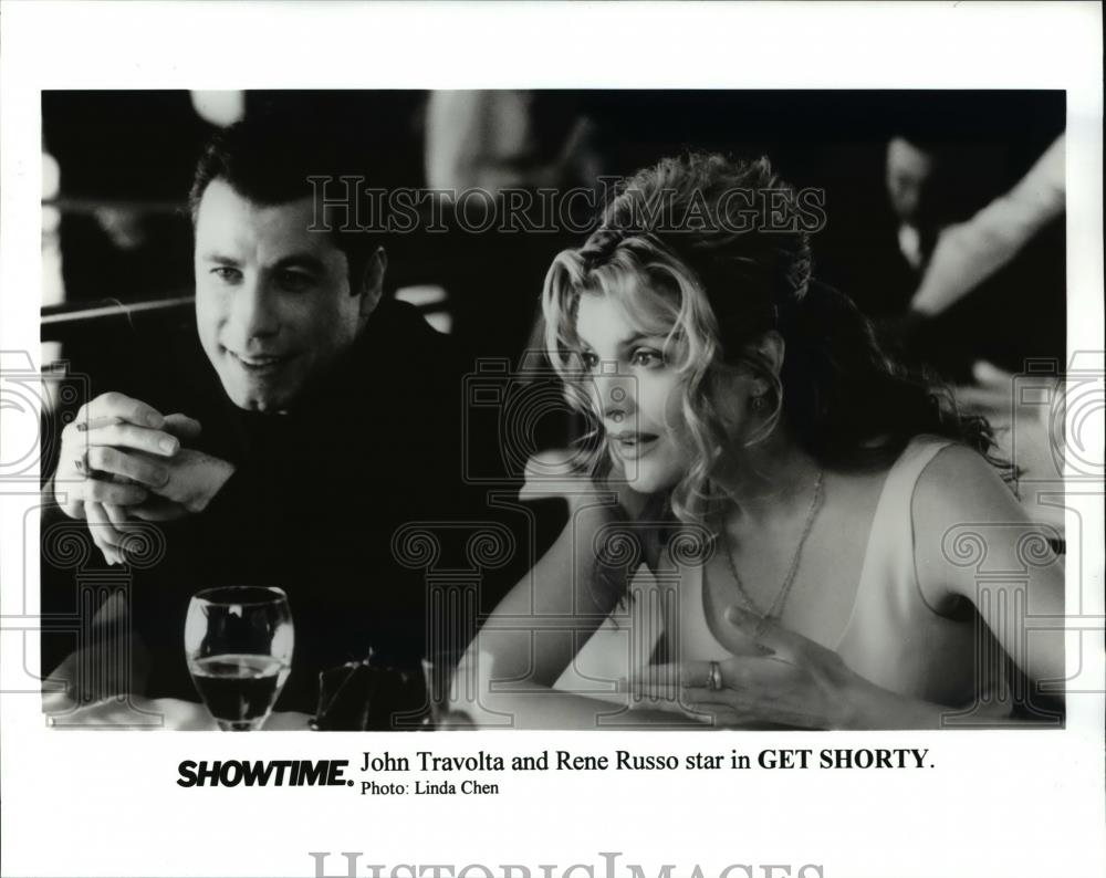 1997 Press Photo John Travolta and Rene Russo in "Get Shorty" - cvp44722 - Historic Images