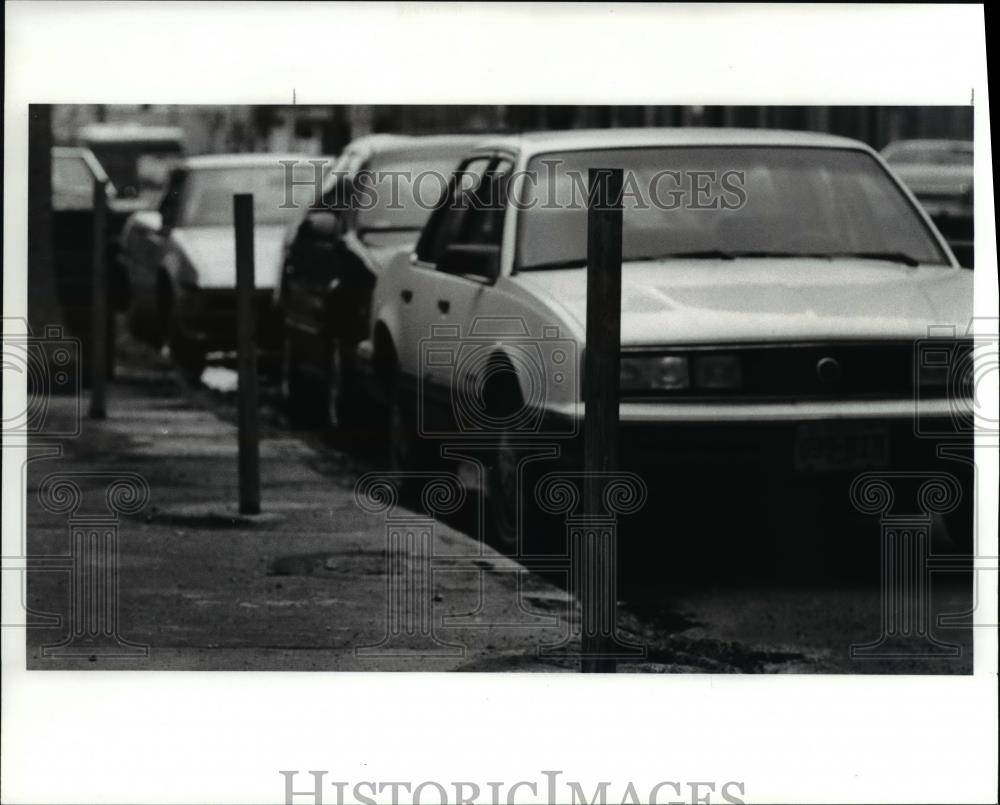 1990 Press Photo Barren poles for parking meters along Chester Ave. near E. 12th - Historic Images