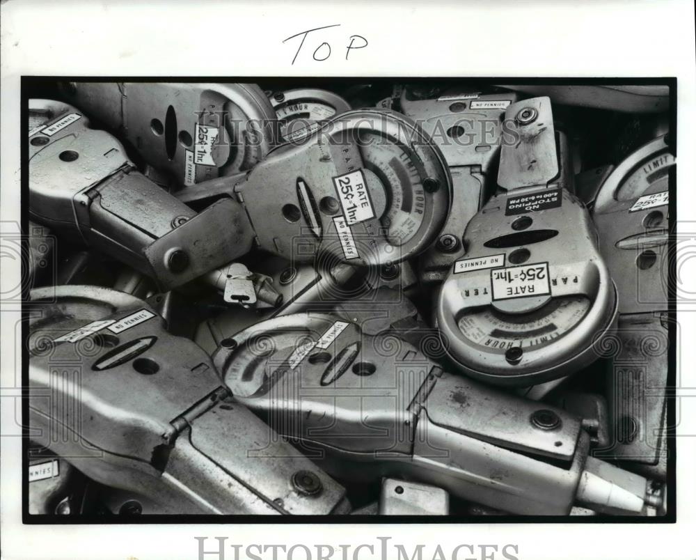 1989 Press Photo Old parking meters piled in the back of a city pick-up truck. - Historic Images