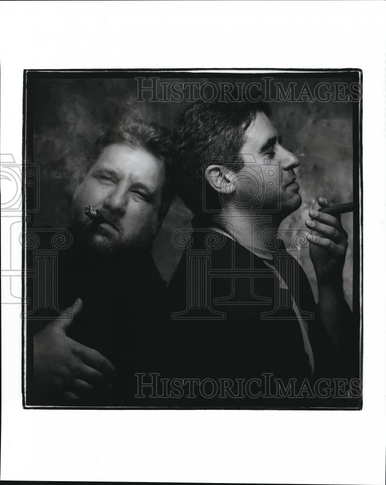 Press Photo Two guys smoking cigars - Historic Images