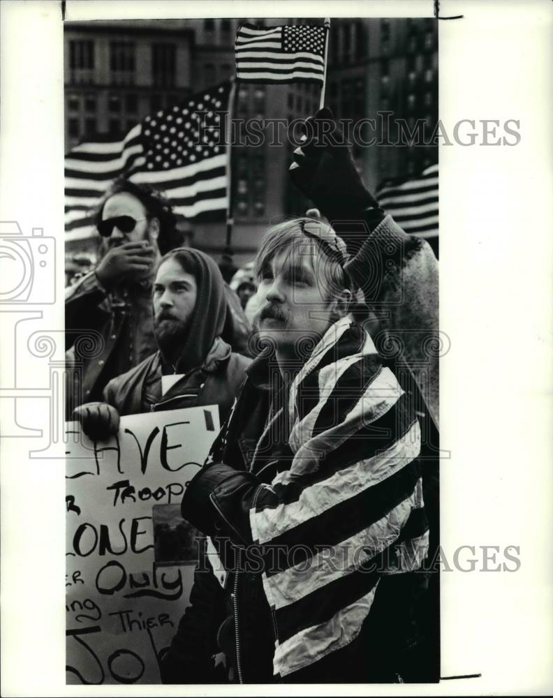 1991 Press Photo Jonathan Konyecsni with flag draped around his shoulders - Historic Images