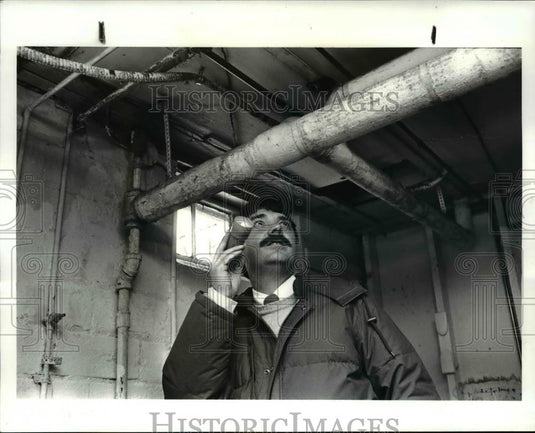 1987 Press Photo Jim Nemastil, Building Inspector inspect Area. - Historic Images