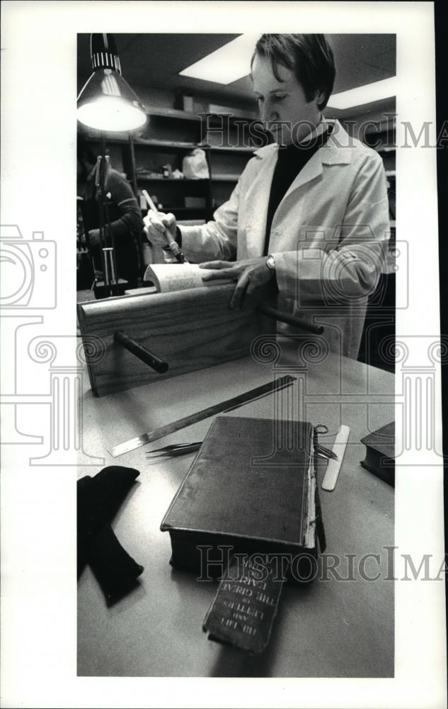 1983 Press Photo Frank Fabry works on a book restoration - cva67077 - Historic Images