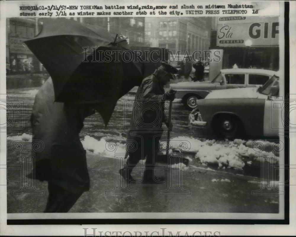 1957 Press Photo Man Battling the Winter Elements in Manhattan - Historic Images