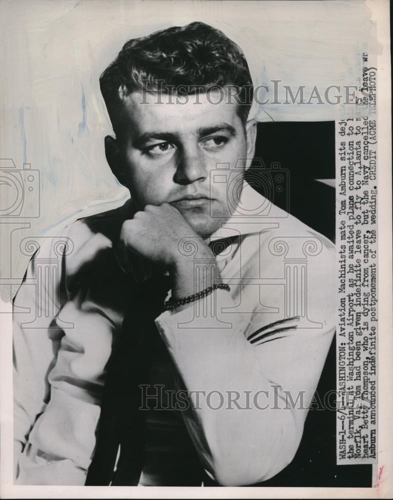 1951 Press Photo Tom Amburn seen at the terminal waiting for his flight home - Historic Images