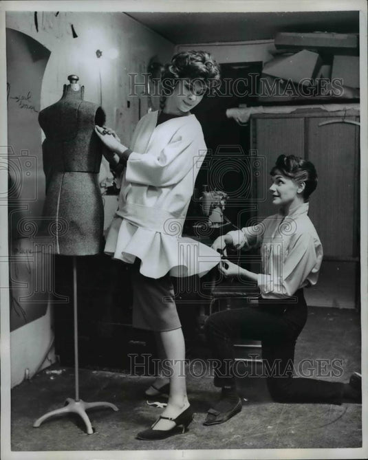 1958 Press Photo Stylist fits coat to model Lyn Baronet - nee06439 - Historic Images