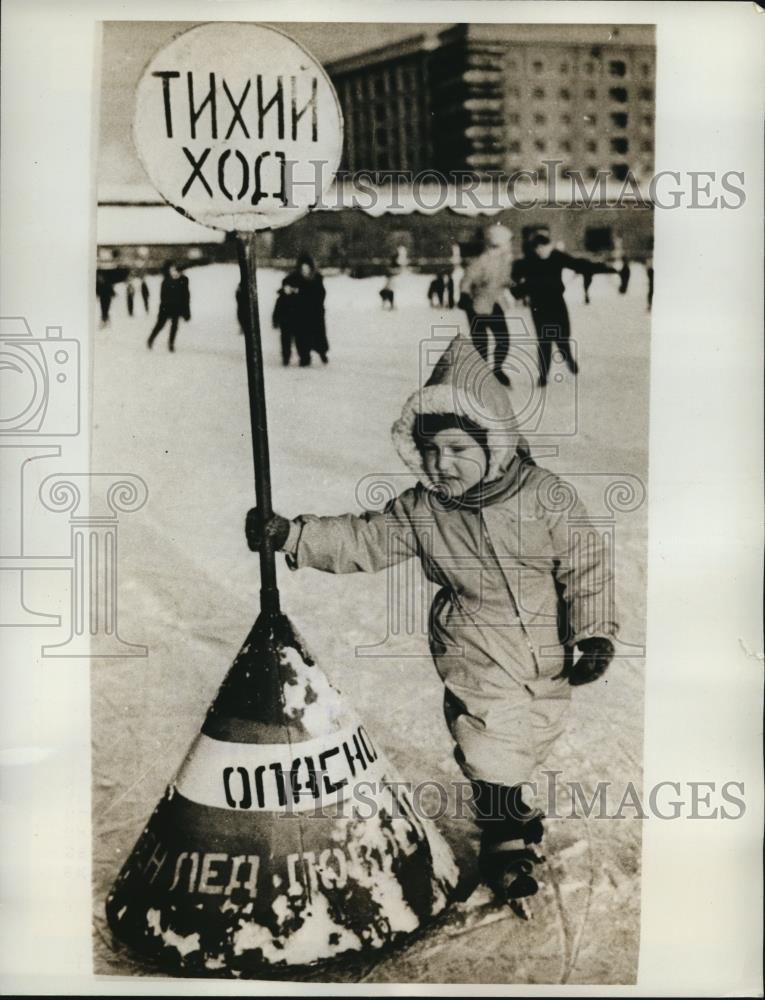 1962 Press Photo Moscow Boy holds sign that Reads &quot;Go Slow&quot; - Historic Images