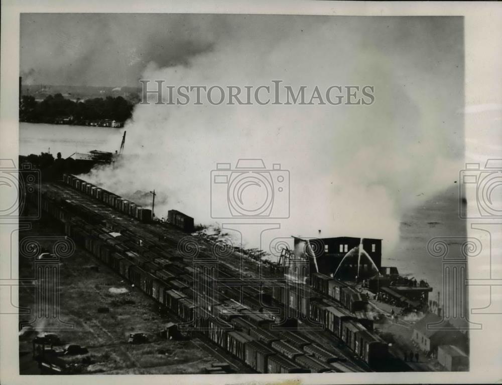 1945 Press Photo Port Edward, Ont Fireman pour water on remains of Long Docks - Historic Images