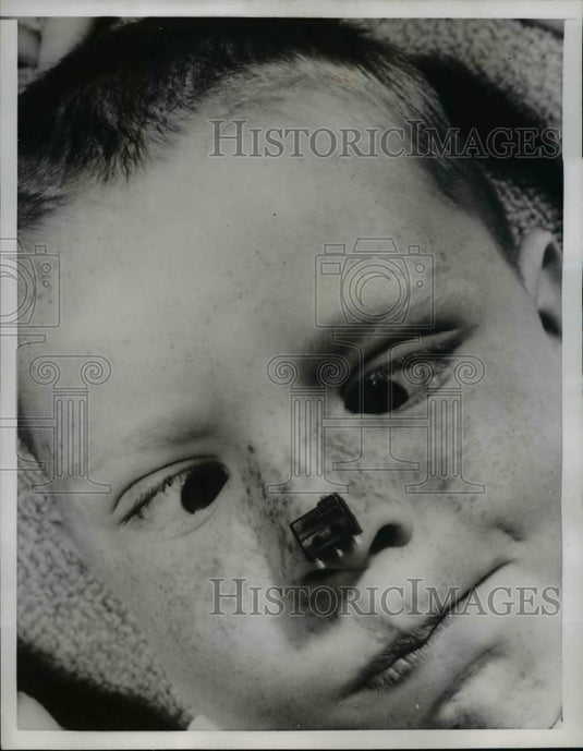 1958 Press Photo Kevin McKay with world's smallest Electrical Switch - Historic Images