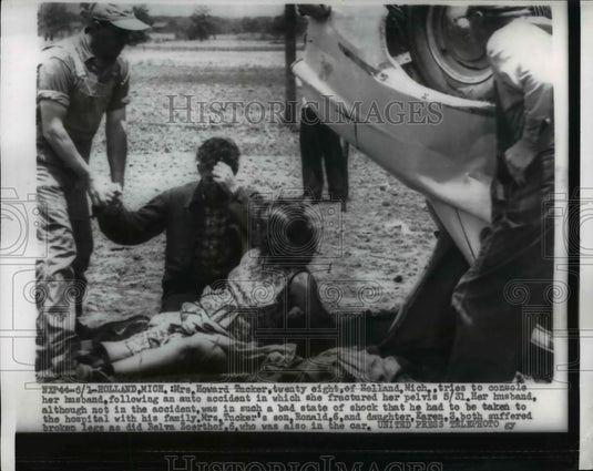 1956 Press Photo Mrs Howard Tucker consoles husband after accident in Michigan - Historic Images