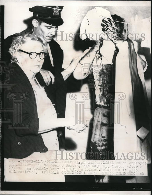 1956 Press Photo Employee of George Saxson Loan Company Beat with Hammer - Historic Images