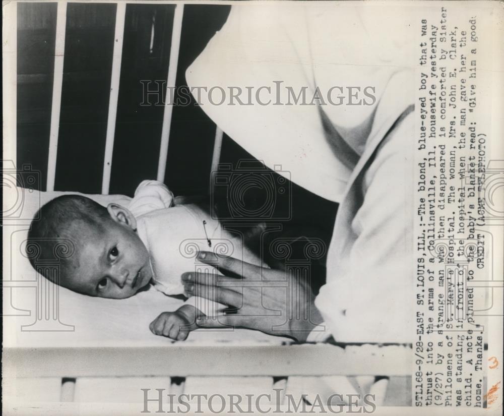 1949 Press Photo Mrs. John E. Clark with the baby that was handed to her - Historic Images