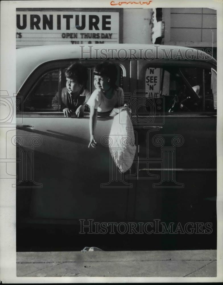 1962 Press Photo Christina and Anna Camarero drop coat outside car, California - Historic Images