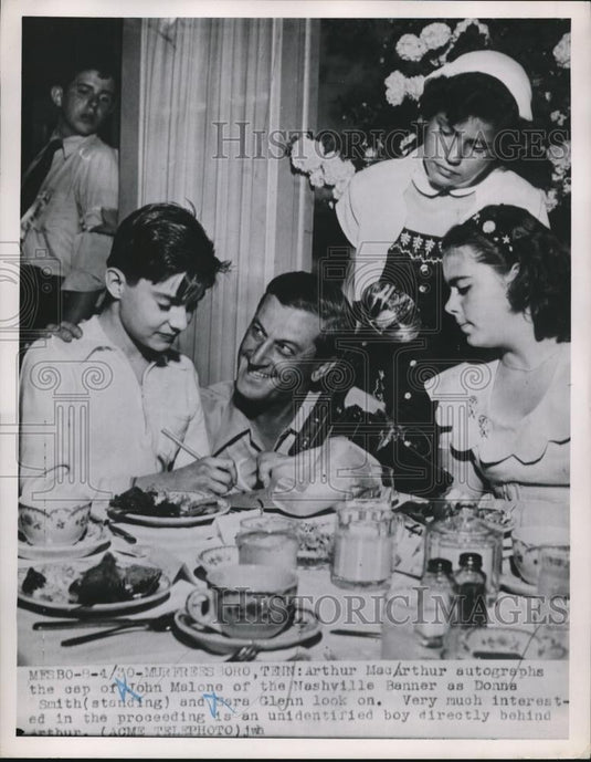 1951 Press Photo Arthur MacArthur signs cap, Donna Smith and Sara Glenn look on - Historic Images
