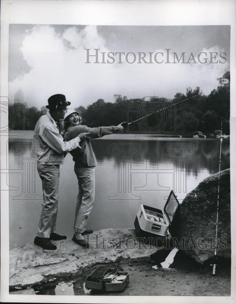 1957 Press Photo Man &amp; Woman Fishing - Historic Images