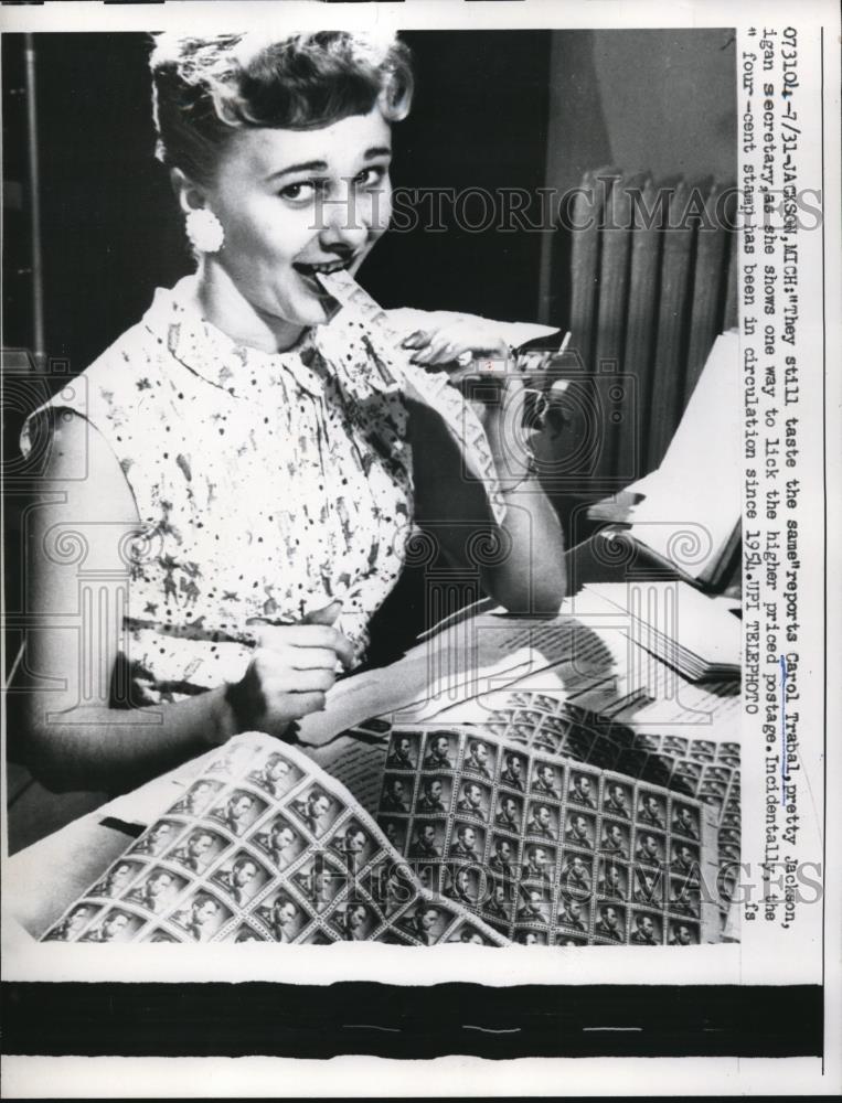 1958 Press Photo Carol Trabal seen licking a higher priced postage - Historic Images