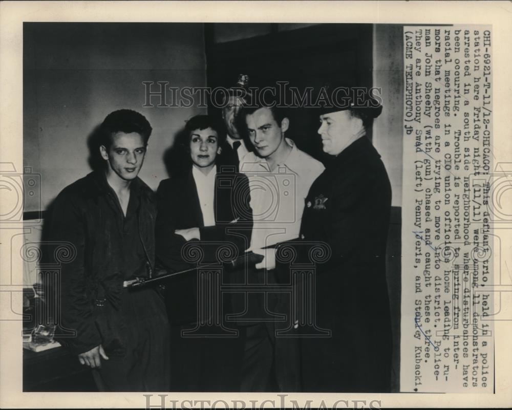 1949 Press Photo Trio Held by Police for Causing Disturbance While Protesting - Historic Images