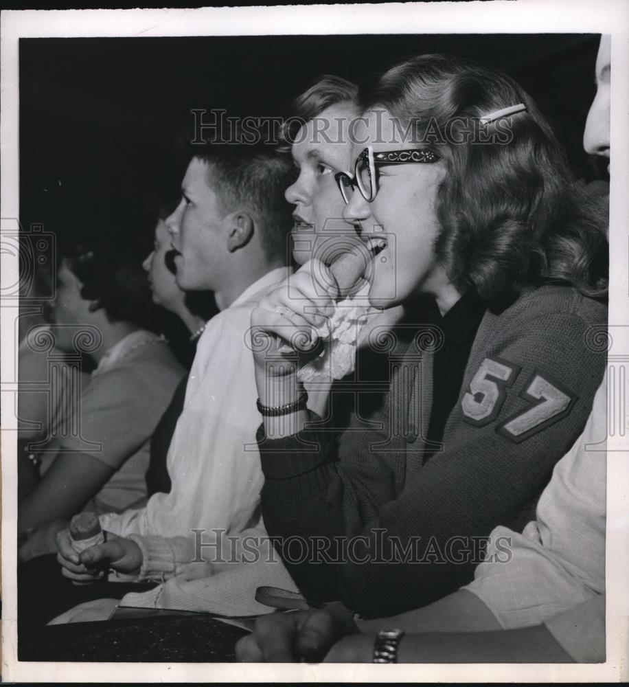 1956 Press Photo Girl Eating Carrot at Basketball Game, Kansas - Historic Images