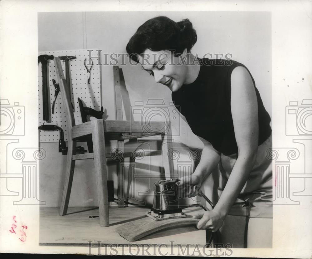 1960 Press Photo Thor Powertool Co woman using a sander on chair parts - Historic Images