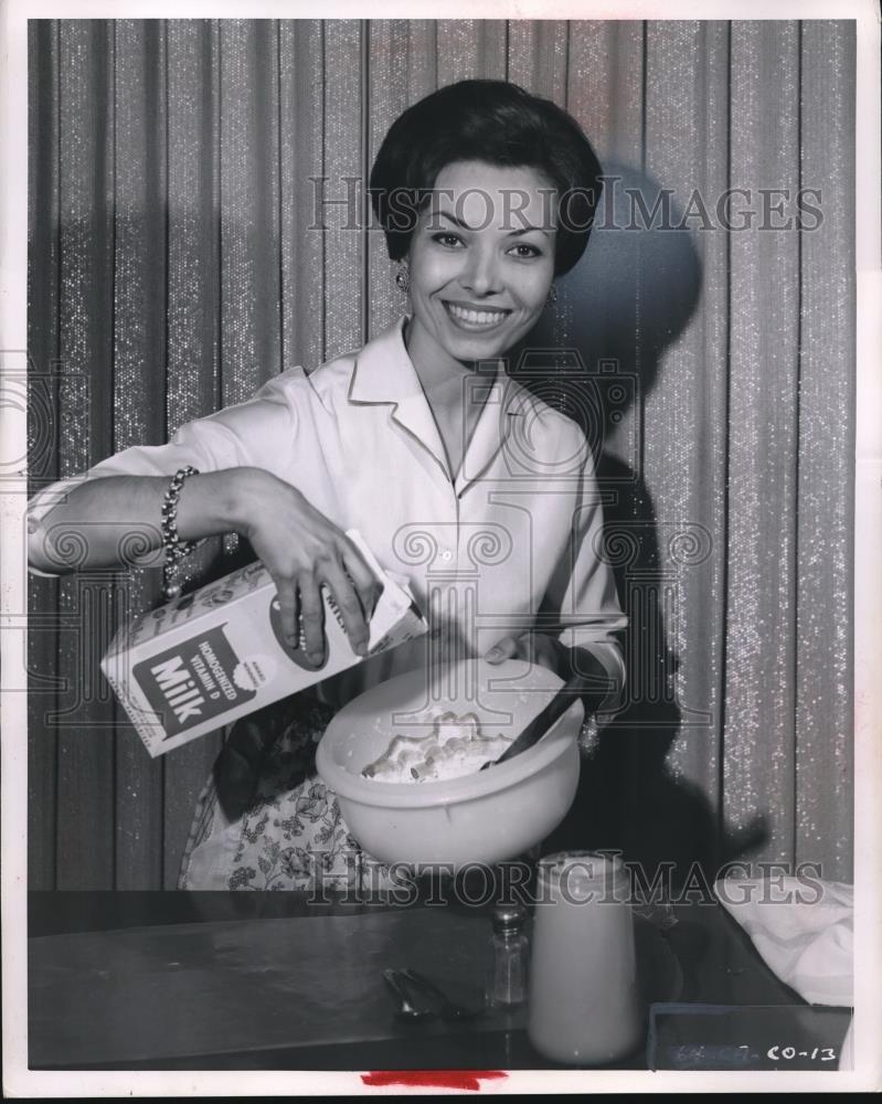 1963 Press Photo Woman Using Milk in Preparing Recipe - Historic Images