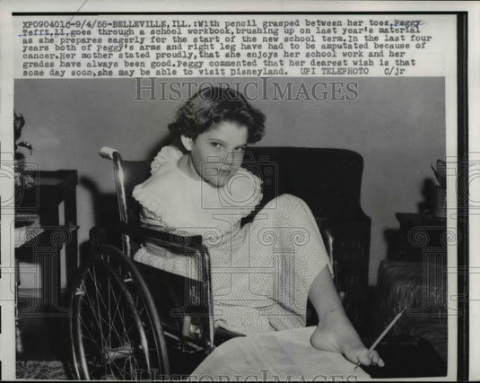 1958 Press Photo Peggy Tefft II goes through work book - Historic Images