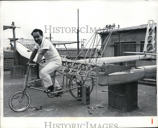1968 Press Photo Toyko Eiji Nakamura pedals bike plane invention - Historic Images