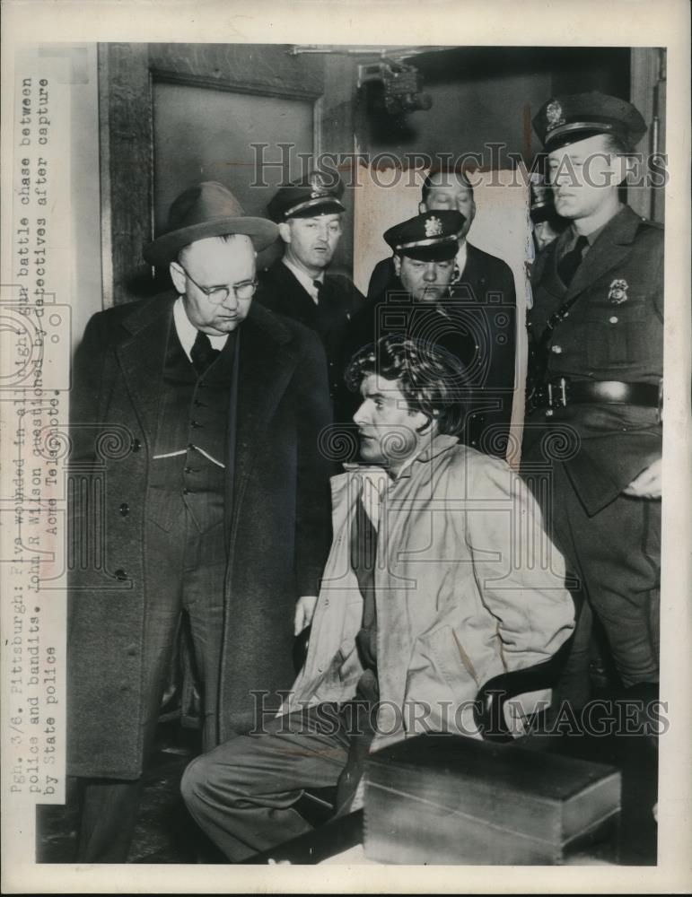 1948 Press Photo John R Wilson Questioned by Detectives in Pittsburgh - Historic Images