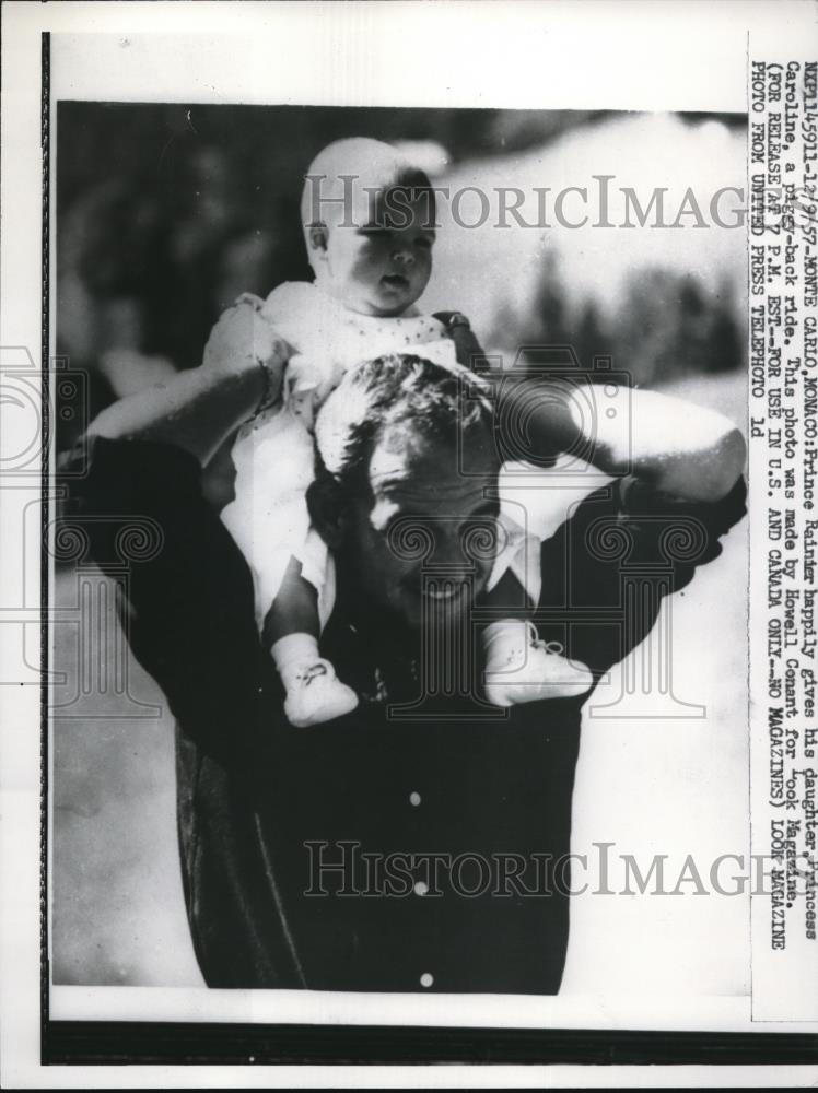 1957 Press Photo Prince Rainier gives daughter Caroline a piggy back ride - Historic Images