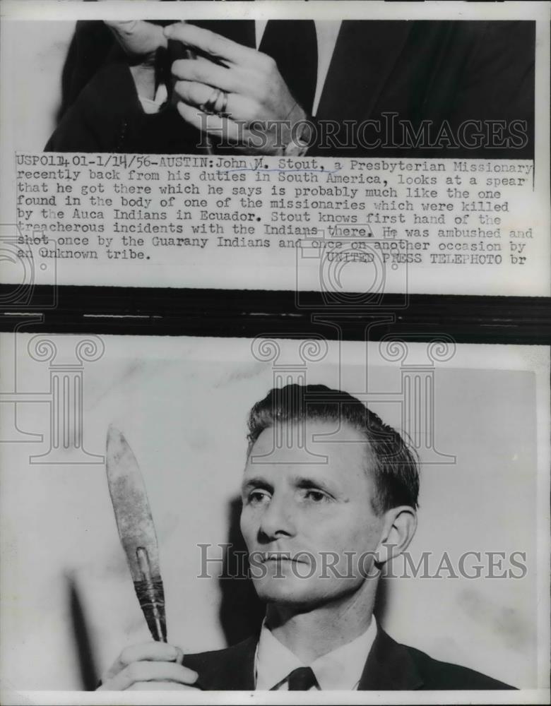 1956 Press Photo John M Stout, back from duties in South America, looks at spear - Historic Images