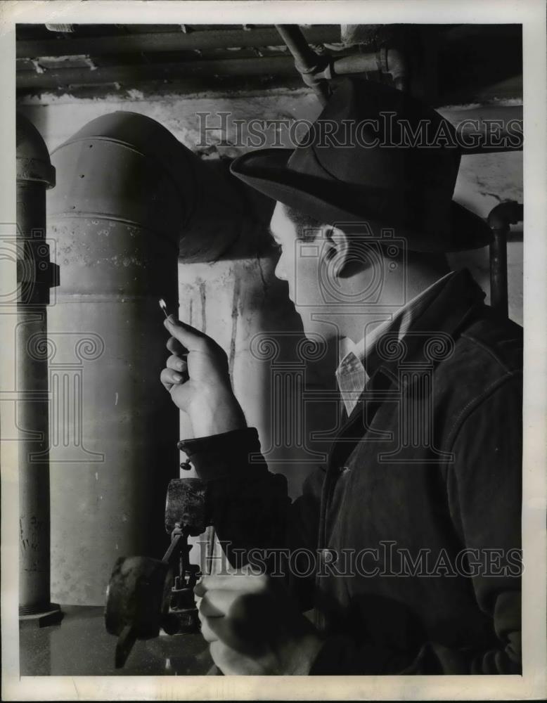 1943 Press Photo Worker Looks for Furnace Smoke-Pipe Leaks - nee22807 - Historic Images